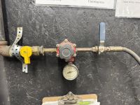 Pre‑regulator and post‑regulator valves on the interior wall